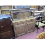 An Early XX Century Oak Court Type Cupboard, carved frieze, linen fold doors, bracket feet, 131cm