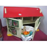 A Dolls House Circa Mid XX Century, to include plastic beds, cooker, wash basin, sink, kitchen unit,