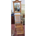 A Hardwood Folding Steamer Chair, together with a wall mirror, 66cm wide.