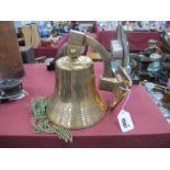 A Brass Ships Bell, with triangular wall attachment, the bell base 17cm diameter.