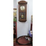 1940's Oak Cased Clock, with a silver dial, Arabic numerals, together with a 1920's oval shaped wall