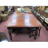 A XIX Century Mahogany Wind Out Table, top with a moulded edge, on turned and reeded legs, (with