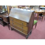 XX Century Oak Bureau, with a fall front, three drawers, on cup-cover supports 92cm wide.