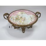 XIX Century Continental Bowl, decorated with cherubs mounted on a gilded stand, decorated with
