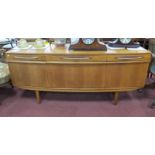 Elliotts of Newbury Teak Bow Fronted Sideboard, circa 1970's with three shallow drawers over central
