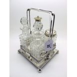 A Mark Willis (MW&S) Plated Four Bottle Condiment Stand, of Classical style with scroll supports, on