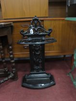 XIX Century Cast Iron Stick Stand, decorated with a cherub holding a basket, with a drip tray,with