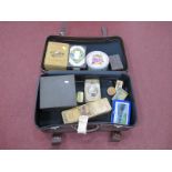 A Brown Suitcase, containing tins, comprising of Thornes Toffee, Glenmorangie Whisky, The Balkan