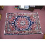 Persian Wool Rug, with a brown border, with deep red-blue centre with floral decoration, 128 x