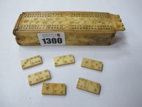 A XIX Century Bone Domino Set, with crib board top in the style of Prisoner of War, 12cm wide.