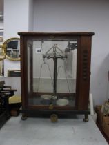 XX Century Oak Cased Laboratory Scales (E Sartorious, Gottingen), on adjustable brass feet, 38cm