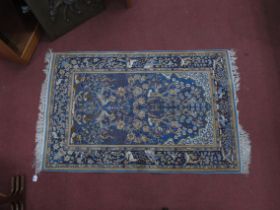 A Middle Eastern Silk Rug, with a central tree of life design with birds, amongst foliage,