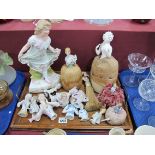 Two Pin Cushion Dolls, with various other loose ceramic pincushion dolls bodies and a bisque