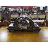 An Art Deco Circa 1930's Walnut Cased Mantle Clock, three hole chiming movement, retailers plaque "