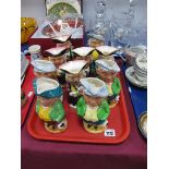 A Set of Ten Burlington Ware Toby Jugs, Town Crier, Singer etc:- One Tray.