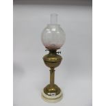 A Victorian Oil Lamp, with pink tinted shade and white pot base by J. Shaw of Walsall.