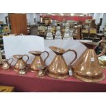 XIX Century Copper Graduated Jugs, imperial gallon to half a gill. (7).