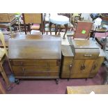 XX Century Oak Bureau, with a fall front, three drawers, on cup-cover supports 92cm wide; A 1950's