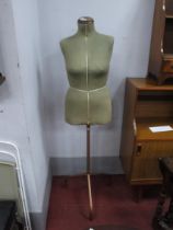 A Mid XX Century 'Singer' Dressmakers Mannequin, on three legged metal adjustable height stand.