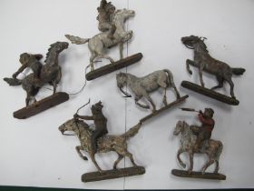 Cowboy and Indian Figures on Horseback, in composition, on oval wooden bases, six horses, four