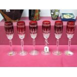 Six Waterford Crystal 'Clarendon' Ruby Flutes, raised on star cut bases, etched marks and labels,