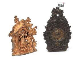 A Late XIX Century Painted Cast Iron Money Box, cast with two bears beside a beehive within a Gothic