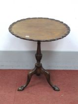 A XX Century Mahogany Pedestal Table, with scalloped top on turned pedestal, cabriole legs and