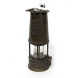 An Eccles M and Q Safety Miners Lamp, 25cm high, handle down.