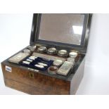 A Mid XIX Century Walnut Cased Travelling Ladies Toilet Case, the lid with central brass