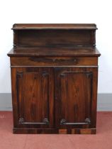 A XIX Century Rosewood Chiffonier, the upper shelf with three-quarter gallery and turned supports,