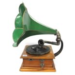 An Early XX Century Table Top Gramophone, with green trumpet horn, stepped square base, winder