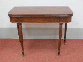A XIX Century Tea Table, with fold-over top on turned legs, 91cm wide.