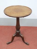 A Mid XVIII Century Mahogany Tripod Table, the circular top with double moulded edge, baluster