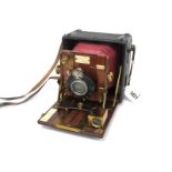 'The Sanderson Camera', a half plate field camera with red leather bellows, mahogany interior,