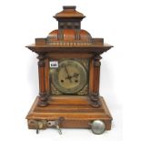 A Late XIX Century Oak Cased Mantle Clock, of architectural form (finials missing), the brass dial