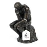 An Early XX Century Bronze Figure Cast as a Naked Gentleman, in thoughtful pose seated on a rock,