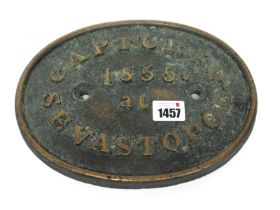 A Brass Oval Sign, cast and inscribed 'Captured at Sevastople 1855', 19 x 24cm.