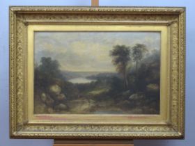 XIX CENTURY ENGLISH SCHOOL Figures on a Path in a Wooded Landscape, with lake beyond, oil on canvas,