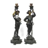 A Pair of Late XIX Century Speltre Figures, cast as Cavaliers, each holding a candle holder and
