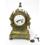 A Late XIX Century Mantle Clock, the gilt metal case elaborately cast with lion mask handles,