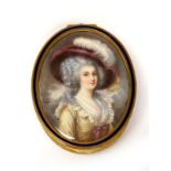 An Early XX Century Oval Gilt Metal Trinket Box, the lid painted with a portrait of a lady wearing a