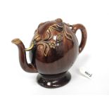 A Brameld Cadogan Pottery Teapot, decorated in a brown glaze and applied with trailing fruit and