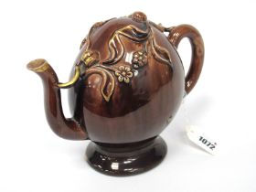 A Brameld Cadogan Pottery Teapot, decorated in a brown glaze and applied with trailing fruit and