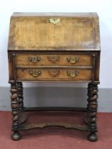 A XVII Century Style Walnut Bureau, with crossbanded top and feather banding, fall front with