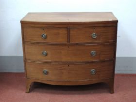 An Early XIX Century Mahogany Bow Fronted Chest of Drawers, with two short and three long drawers,