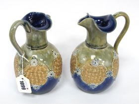 A Pair of Royal Doulton Stoneware Ewers, with frilled necks, the bodies with gilt scroll panels