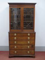 An Early XIX Century and Later Mahogany Secretaire Bookcase, the top with dentil cornice over twin