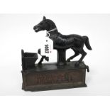 A Late XIX Century Mechanical Cast Iron Money Box 'Trick Pony', the lever tips the head and coin