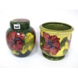 A Moorcroft Pottery Ginger Jar and Cover, of ovoid form, painted in the 'Hibiscus' pattern with