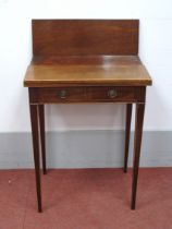 A George III Mahogany Work Table, with fold-over top supported by dummy drawer to rear, with